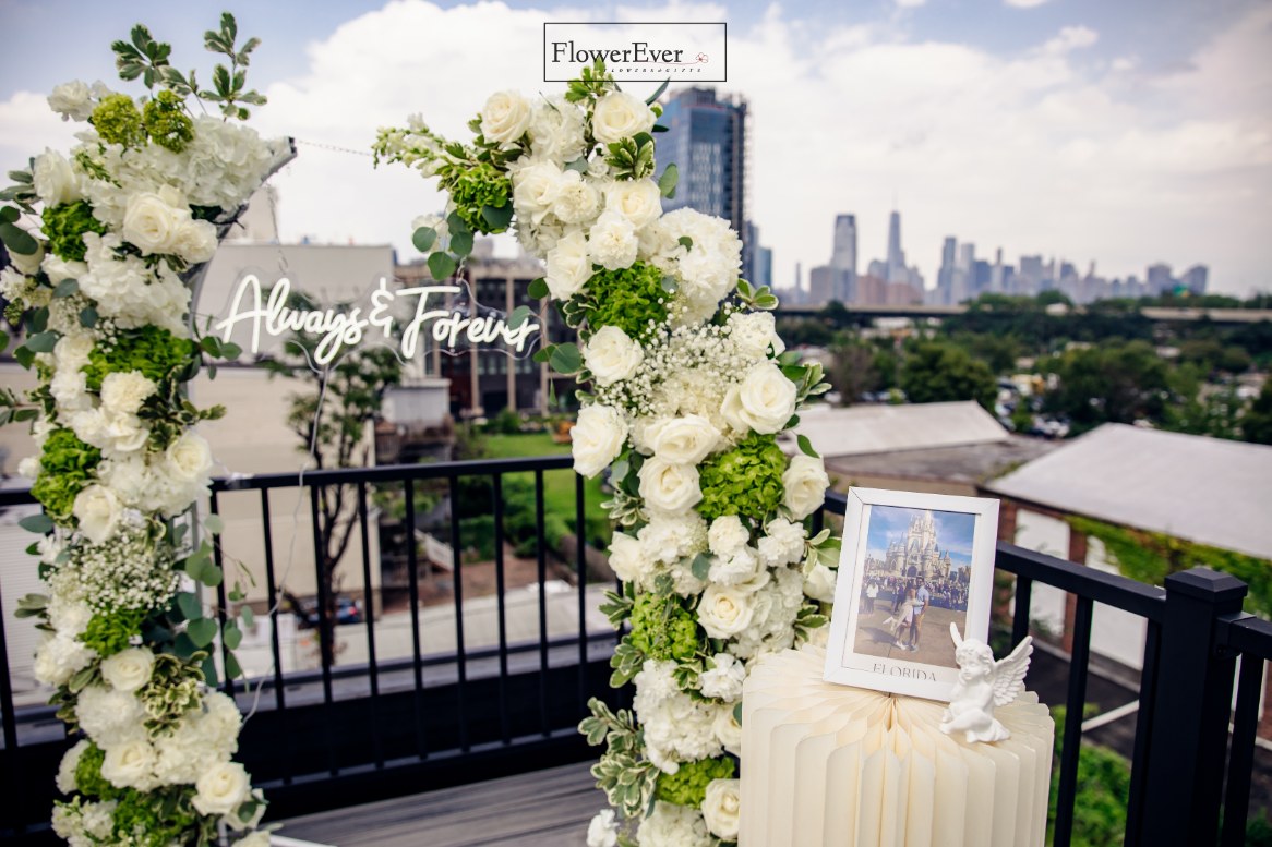 Cherish the moment with our NYC Proposal Package: Floral Arch & Aisle Flowers
