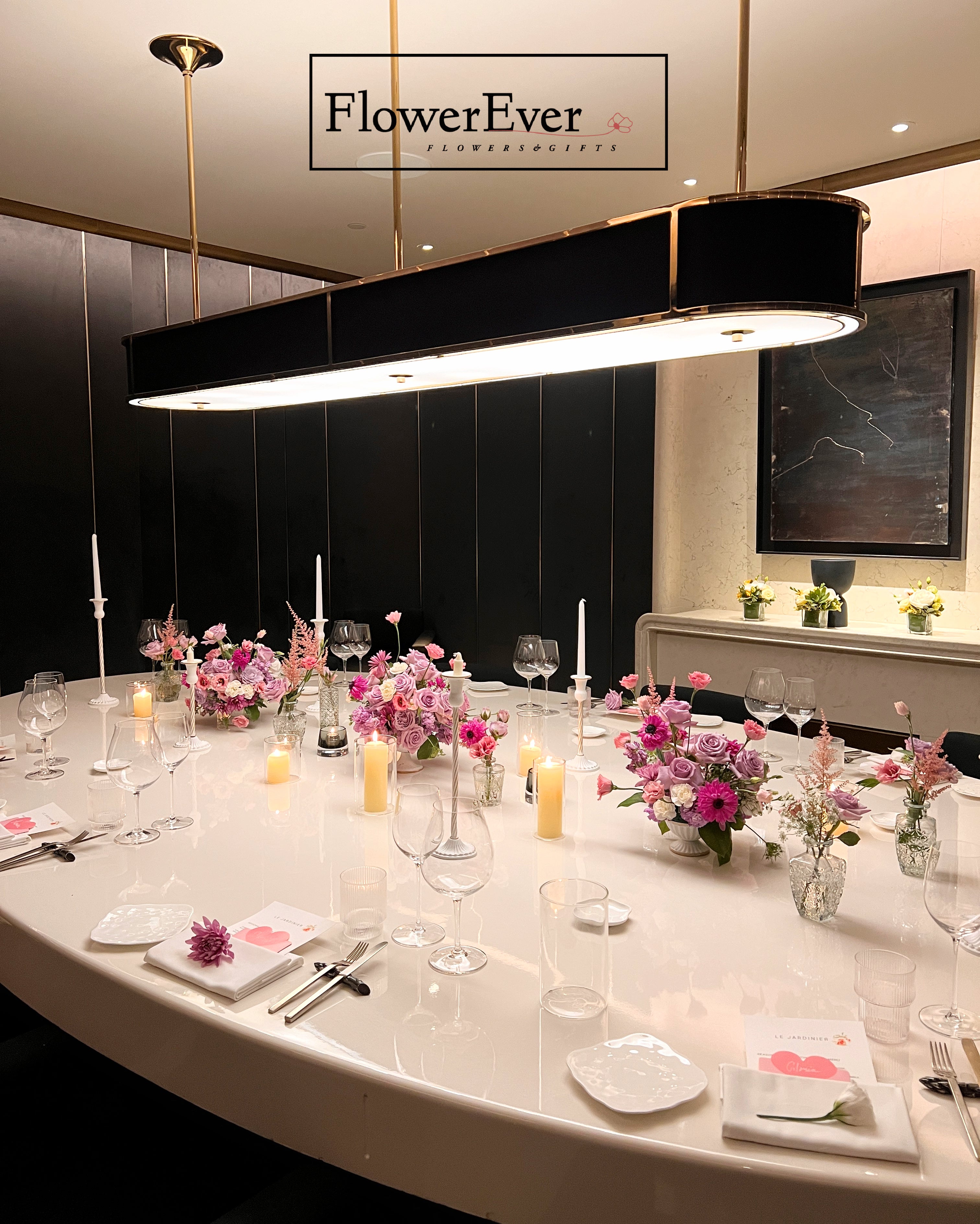 Dining table set with floral centerpieces and &