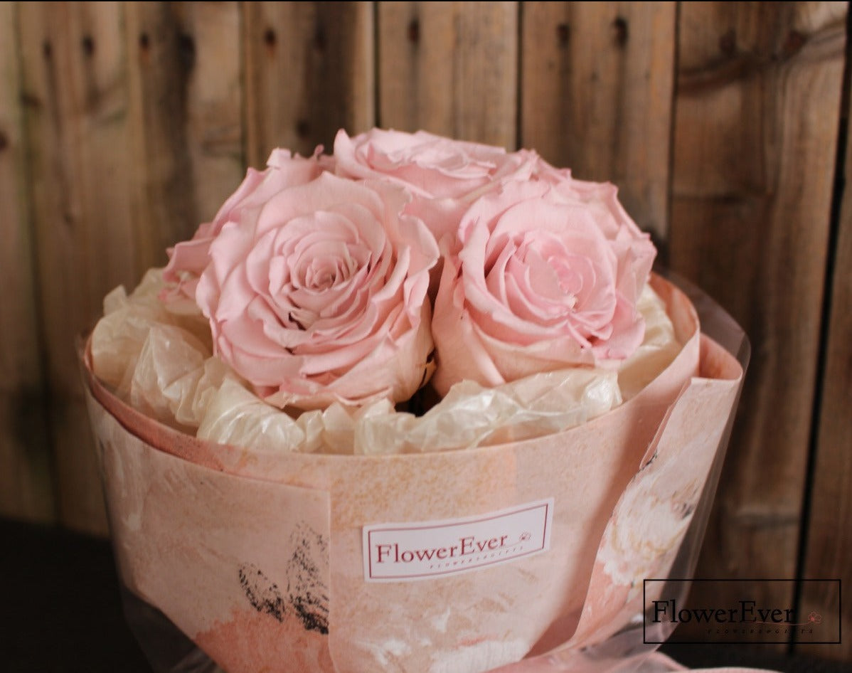 A petite preserved flower bouquet with 6 stems in a Russian style, including pink roses