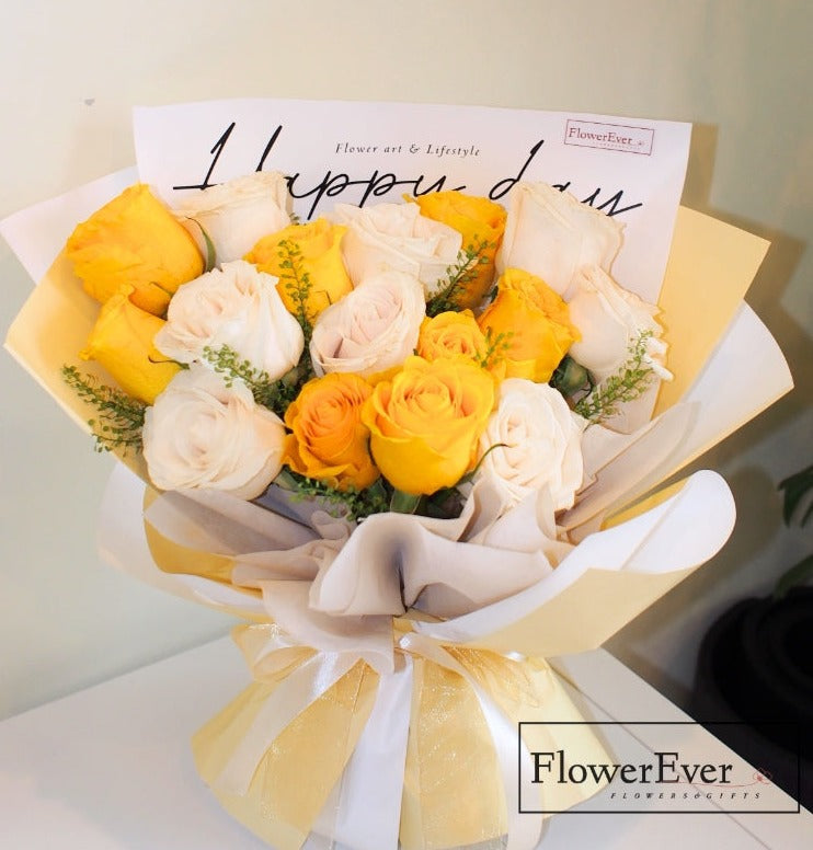 Sweet and Bright: 16 Yellow & White Roses in Pastel Yellow Packaging