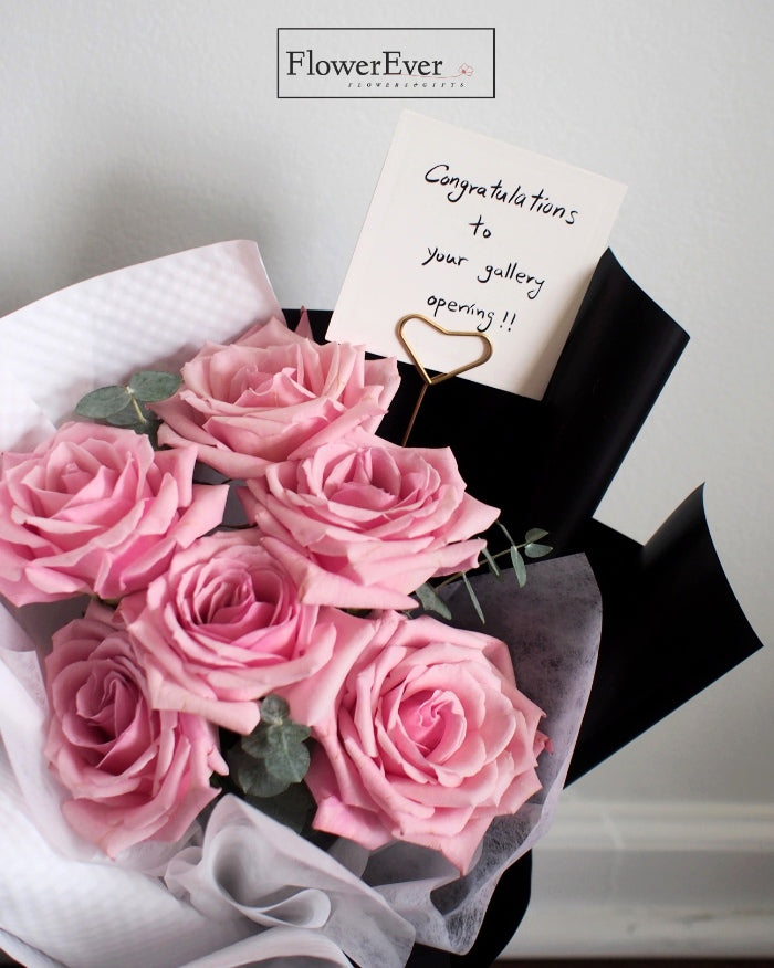 Breathtaking Pink Rose Arrangement | 12 Stems in Black & White Floral Wrap