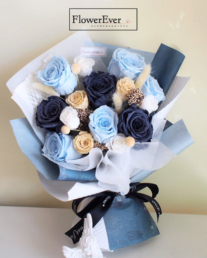 A dozen cool-toned blue preserved roses paired with neutral nude and white buds in a mixed bouquet.