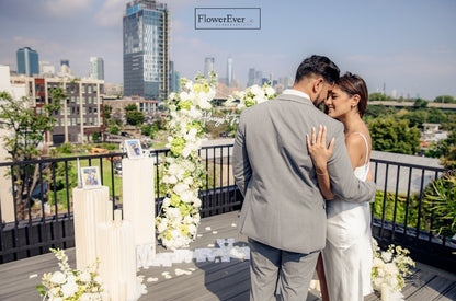 Create a memorable proposal in NYC with our Floral Arch and Aisle Flowers