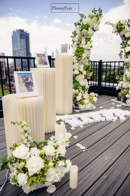 Elevate your proposal with our NYC Decor Package: Floral Arch + Aisle Flowers