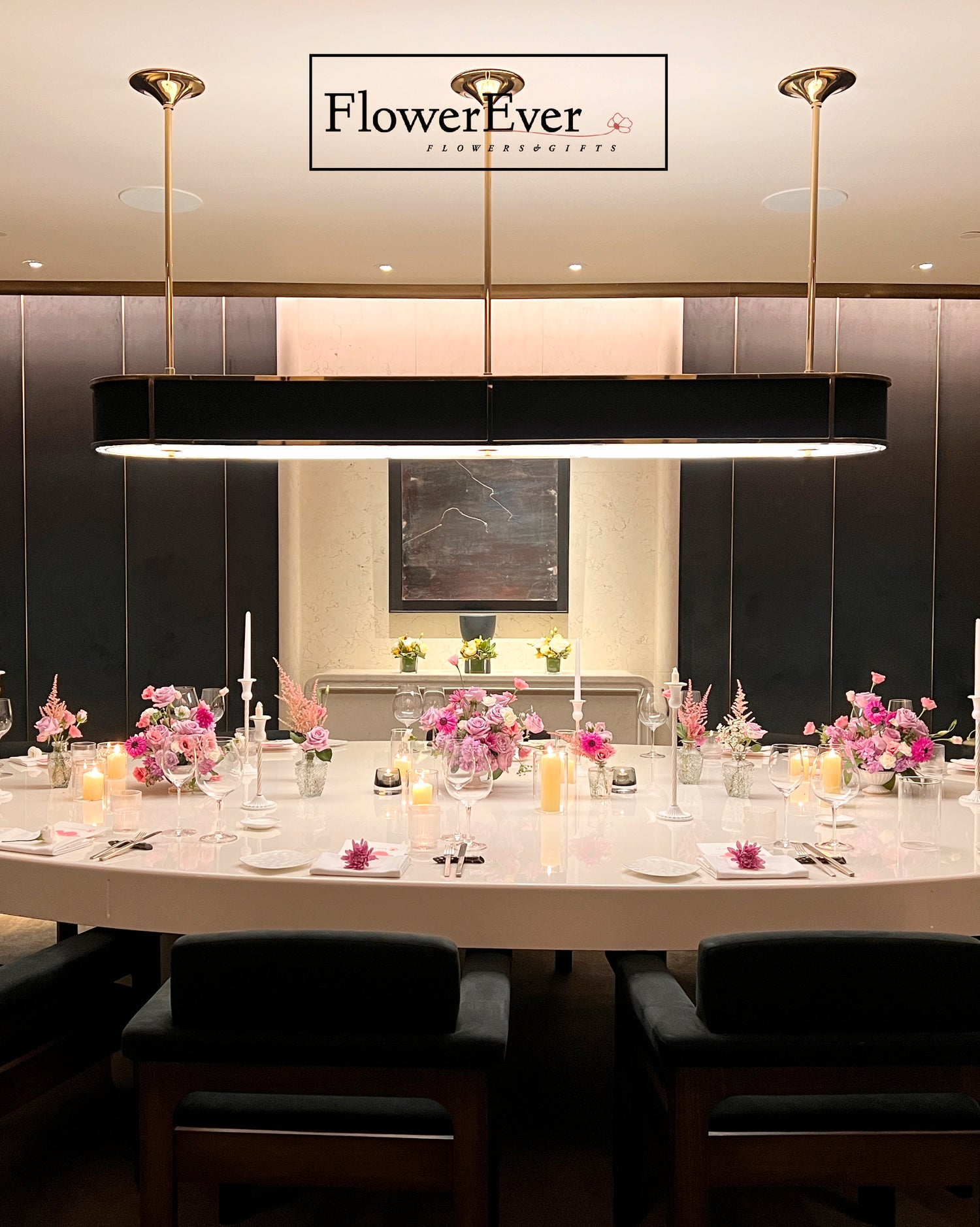 Dining table set with floral arrangements in a restaurant, featuring &