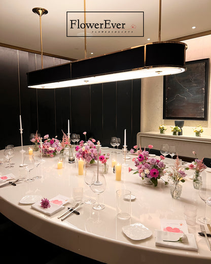 Dining table set with floral centerpieces and &