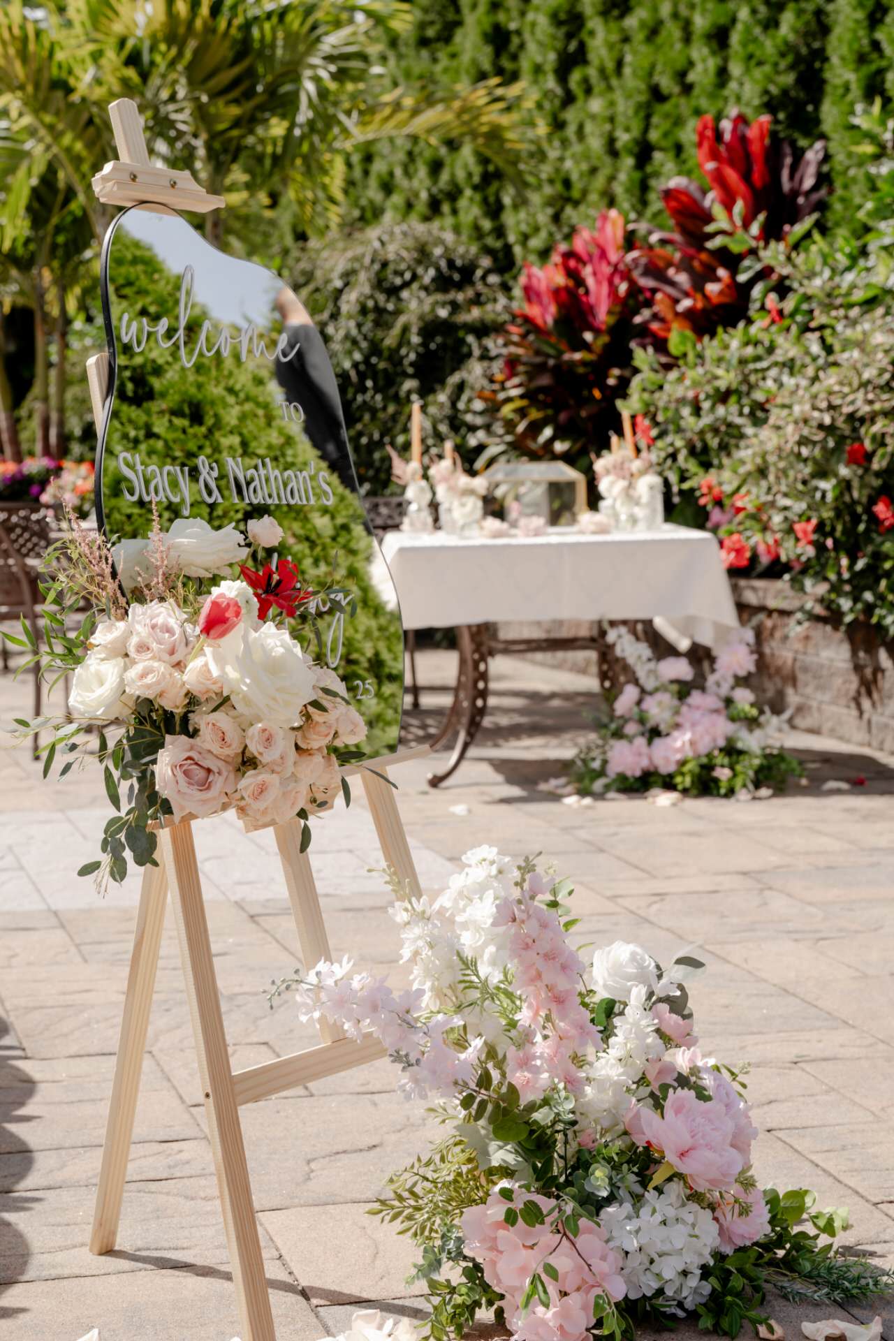 Decorative setup with floral arrangements and a &