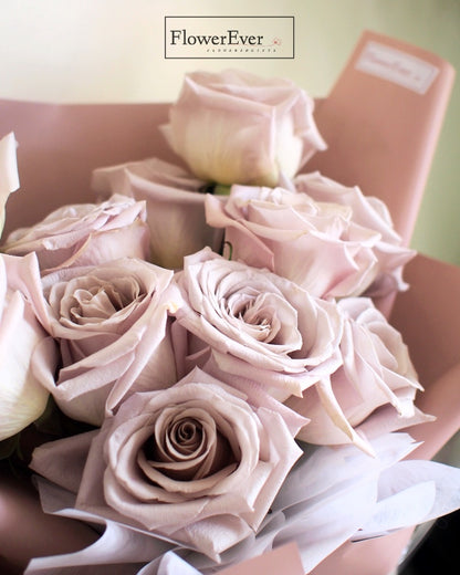 A Dozen Beautiful Pink Manta Roses in a Pink Paper Wrap