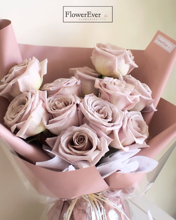 12 Stems of Exquisite Pink Manta Roses in a Floral Paper Bundle