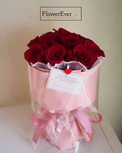 Elegant 12-Flower Arrangement of Red Roses in a Pink Bucket