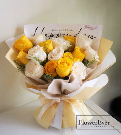 A Beautiful 16-Stem Rose Bouquet with Yellow and White Roses in Pale Yellow Paper