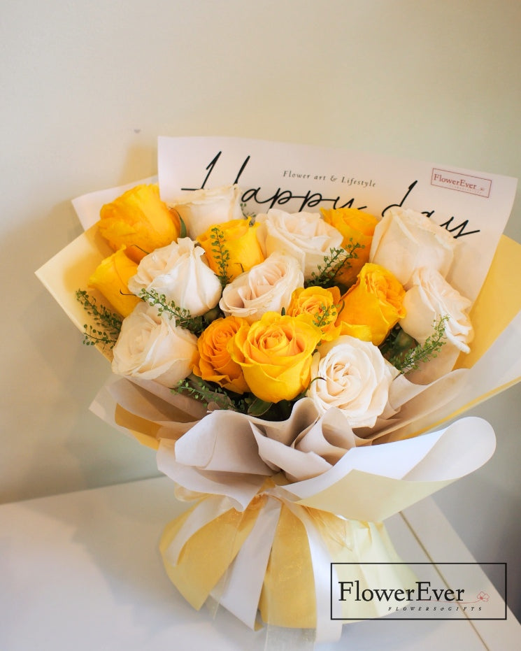 Cheerful 16-Stem Yellow and White Rose Arrangement in Soft Yellow Wrap