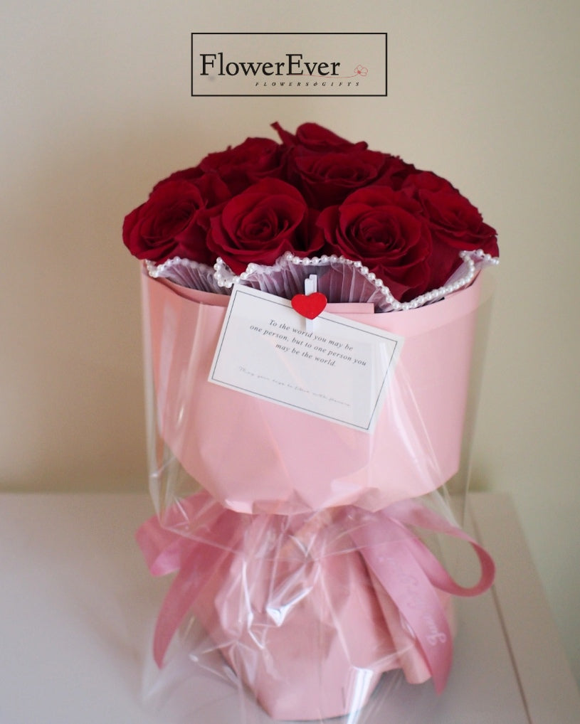 Vibrant Red Roses in a Charming Pink Bucket | 12 Blooms