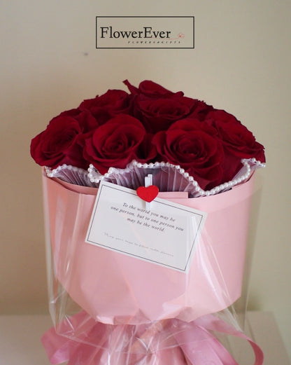 A Lovely Bouquet of 12 Red Roses in a Pink Paper Pail