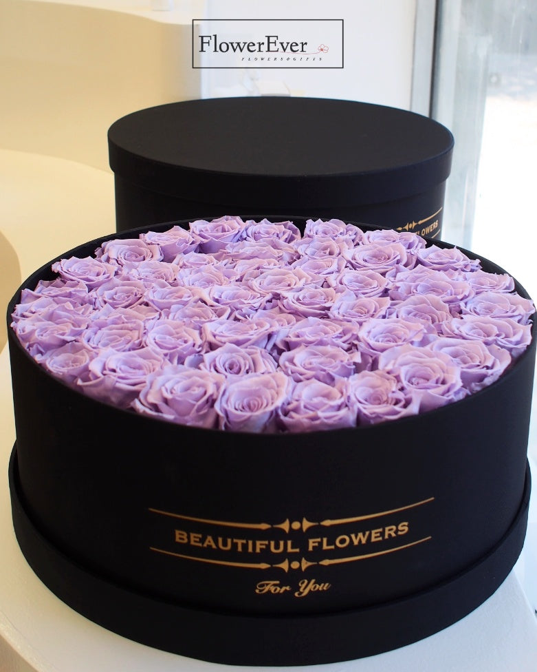 50 vivid purple preserved rose arranged in a stylish black gift box.