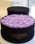 50 vivid purple preserved rose arranged in a stylish black gift box.