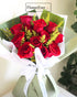 A Regal Display: 12 Crimson Red Roses Wrapped in Classy Green Paper