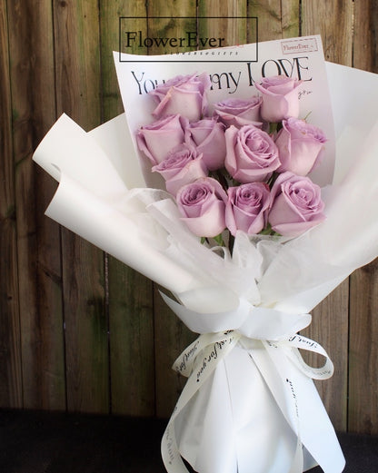 Elegant 12-Stem Purple Rose Bouquet Wrapped in White Floral Paper