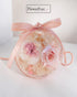 pink hanging ornament for Christmas with preserved pink flowers 