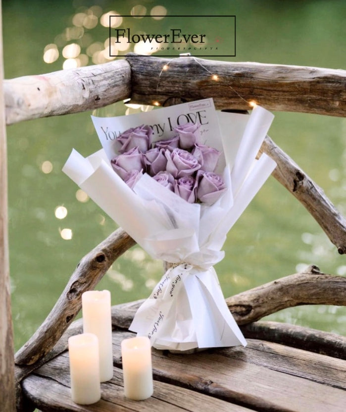 Charming Purple Roses in White Floral Packaging | 12 Stems