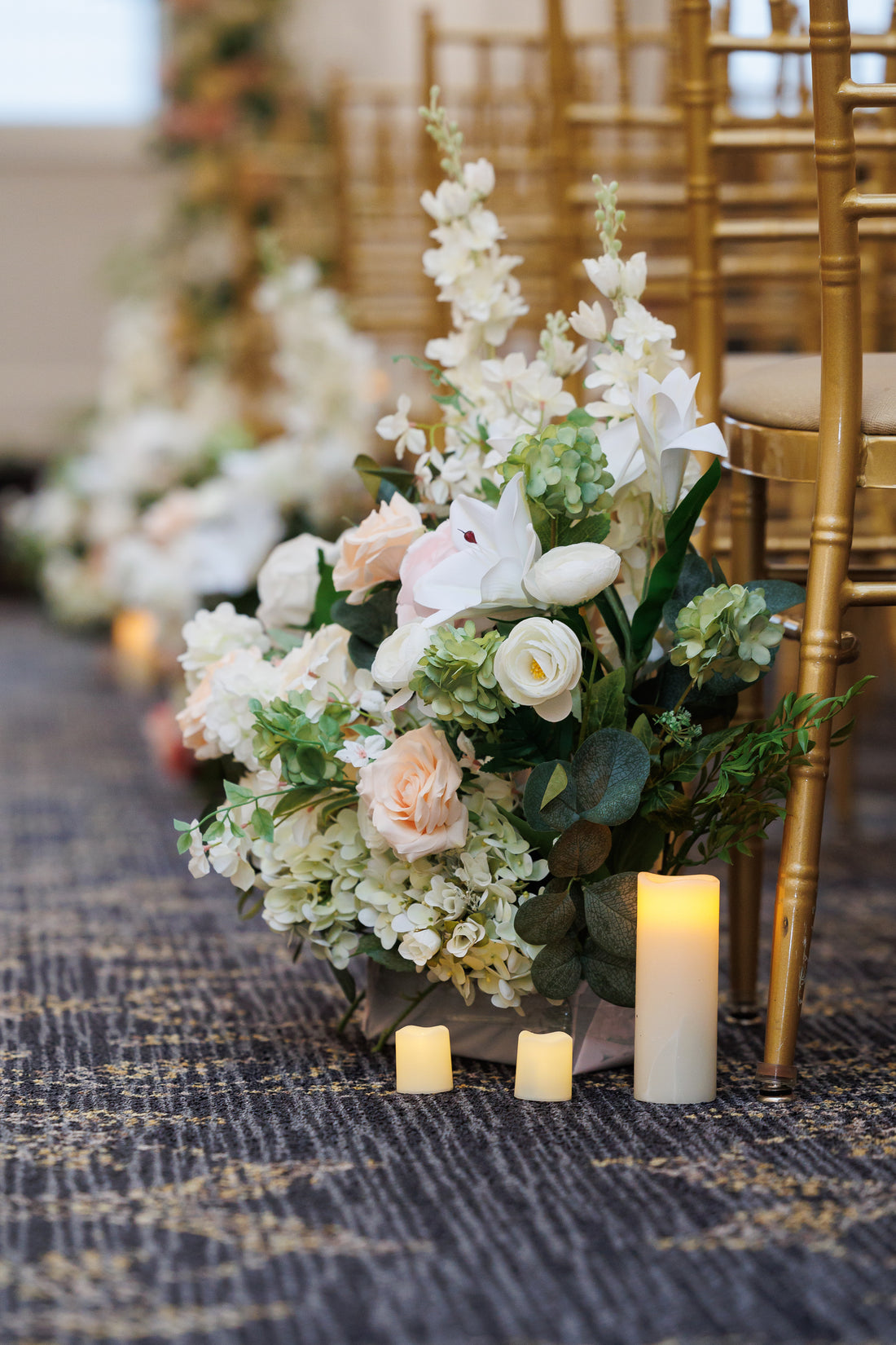 Sophisticated floral arrangement for NYC wedding ceremony aisle