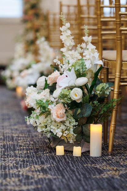 Sophisticated floral arrangement for NYC wedding ceremony aisle