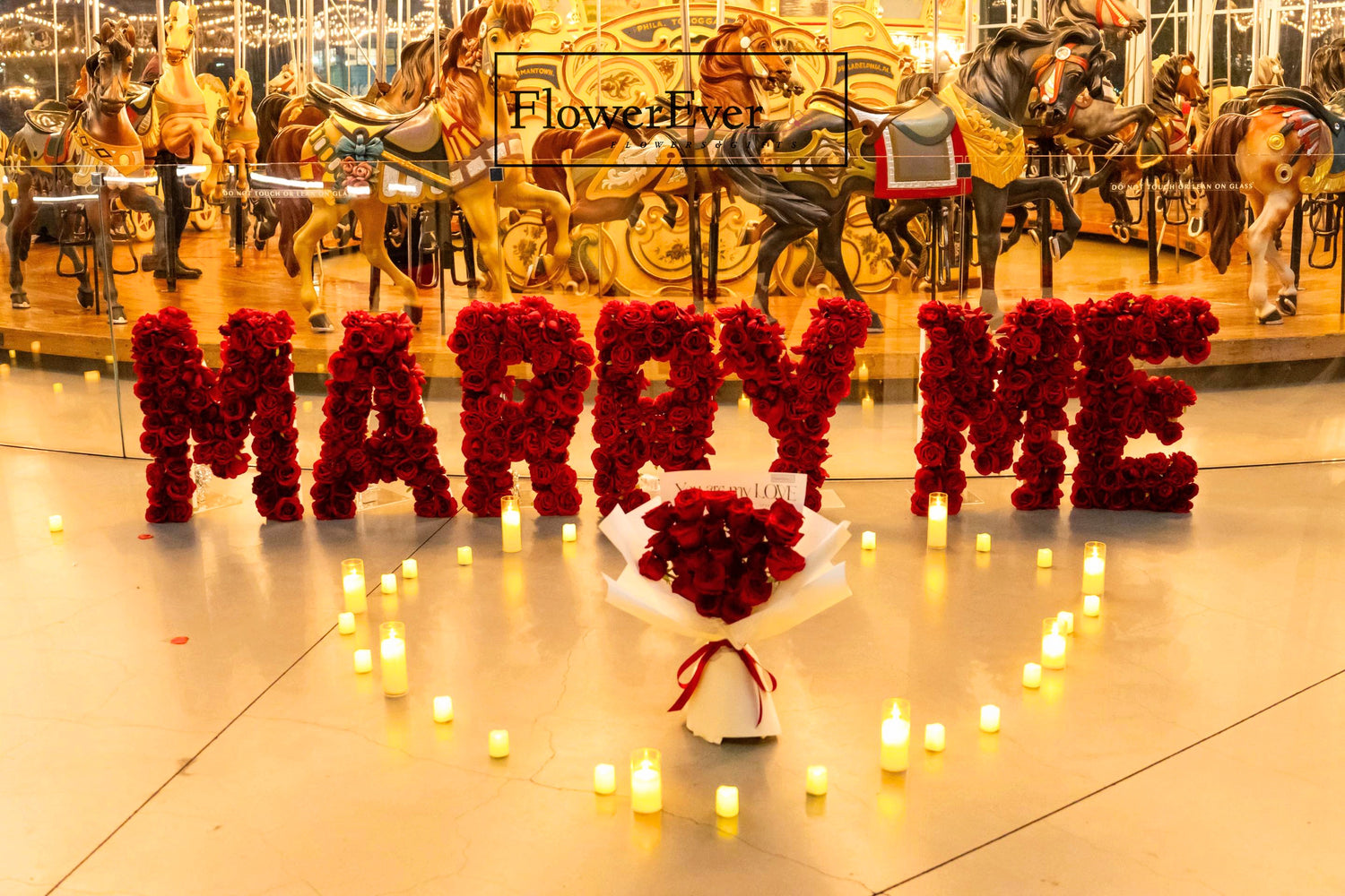 Chic NYC red rose, marquee letters, and candle proposal setting