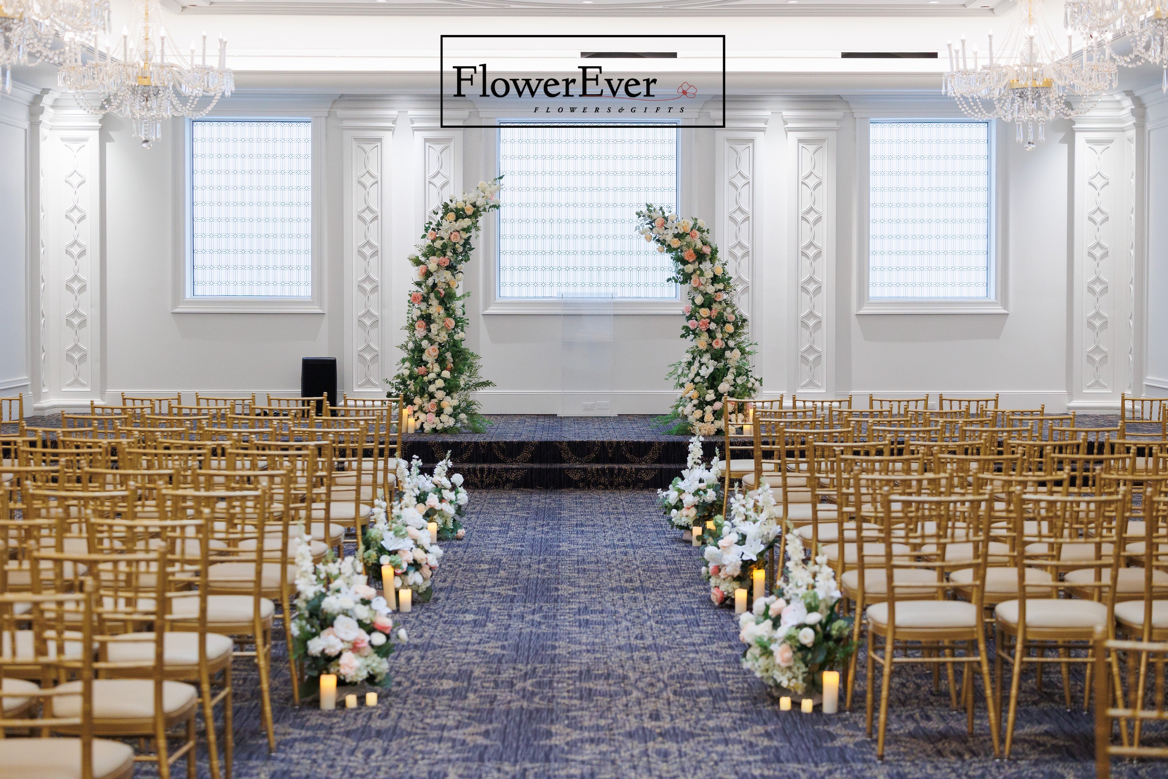 Modern NYC wedding floral arch with a crescent moon flower stand