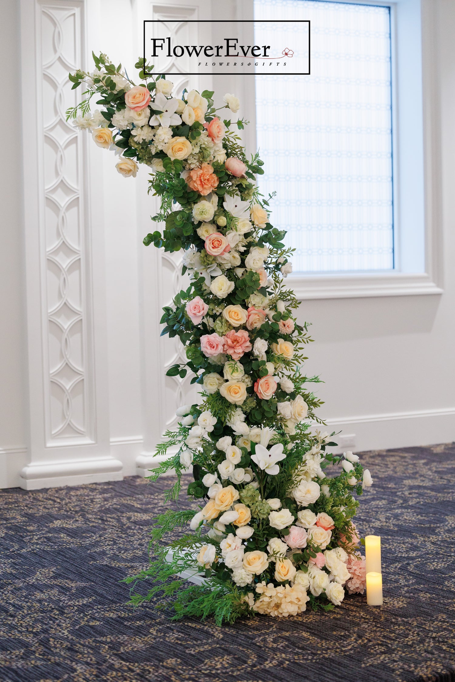 Stylish NYC wedding crescent moon arch with lush flowers