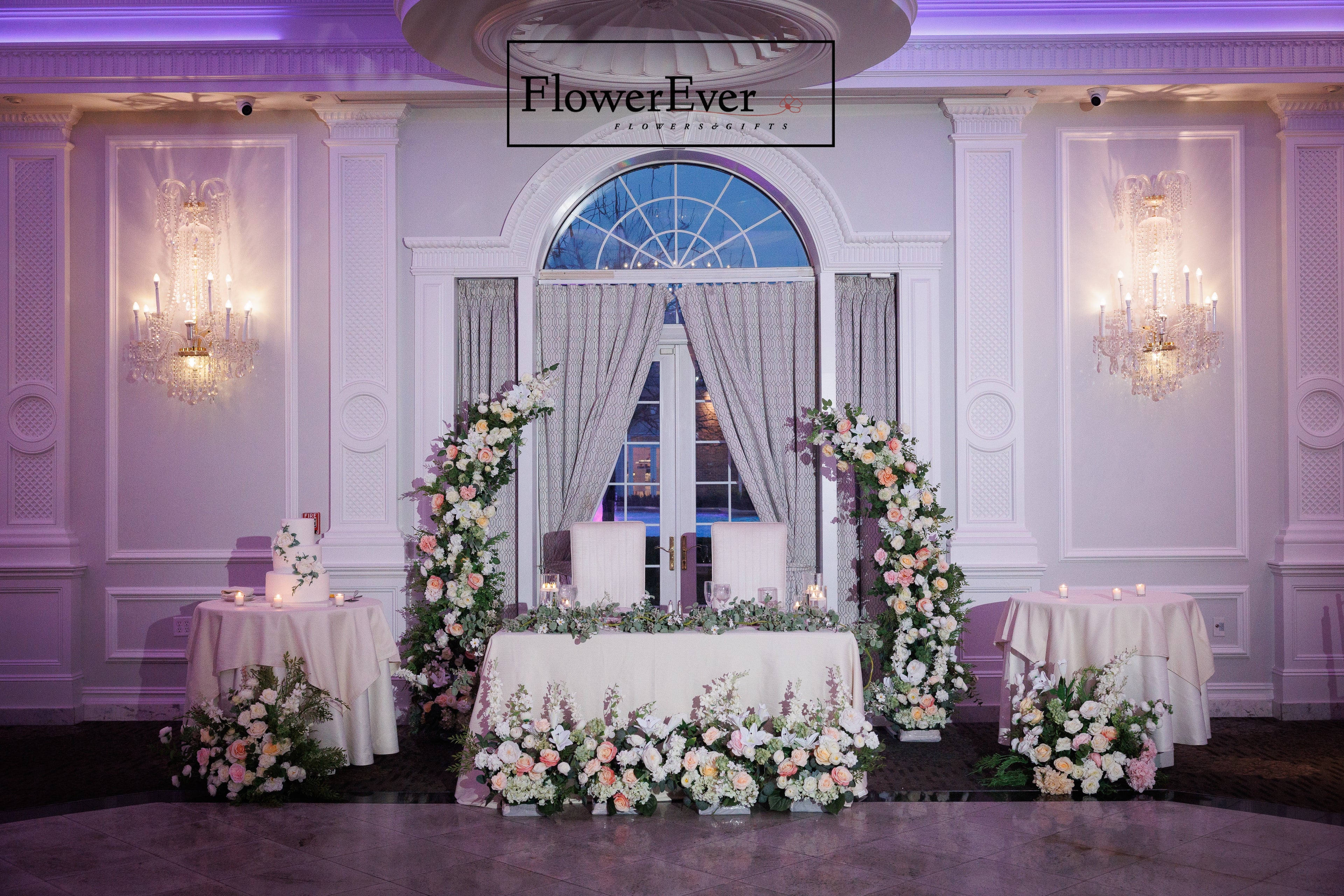 Chic NYC wedding with a modern crescent moon flower arch